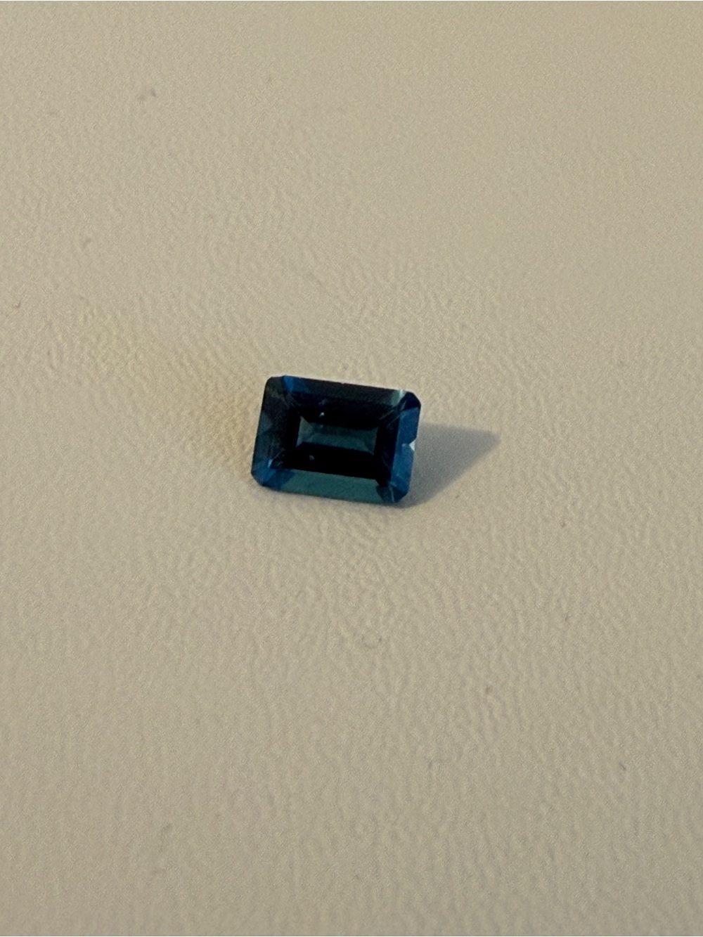 Emerald-Cut Dark Blue Gemstone Ring Centerpiece